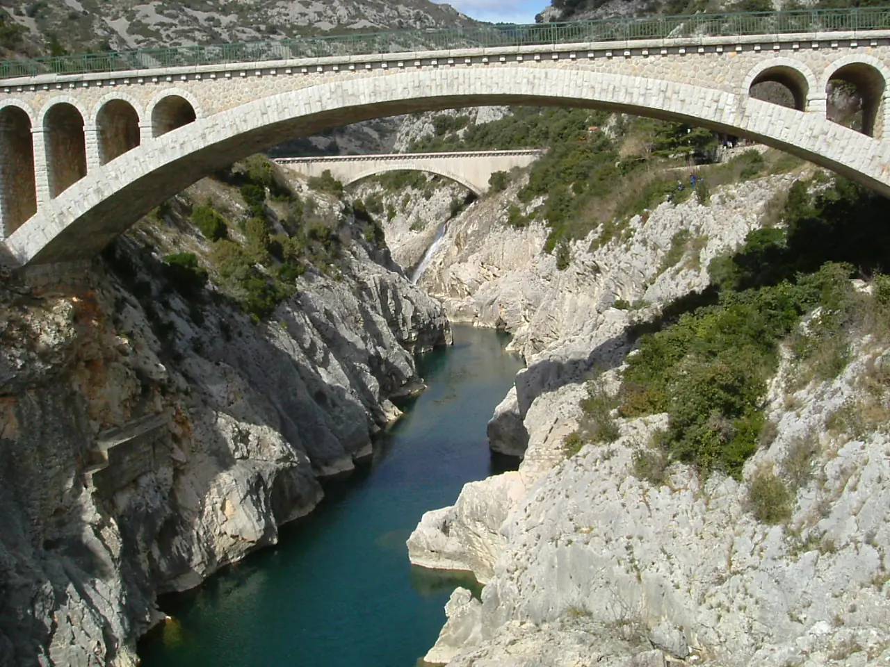 Bridge and aqueduct over Hérault river near Saint-Guilhem-le-Désert, seen from Pont du Diable, Hérault, France - 20050308
