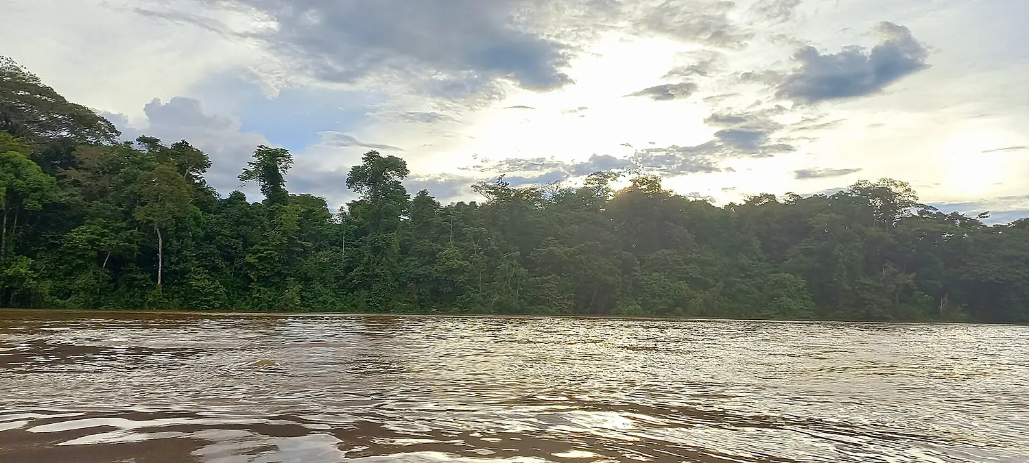 RIO TIGRE ATARDECER SOL ENTRRE LAS NUBES