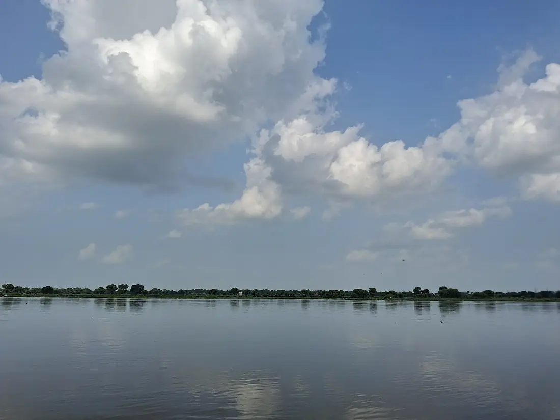 A serene scene with clouds and river Yamuna, India